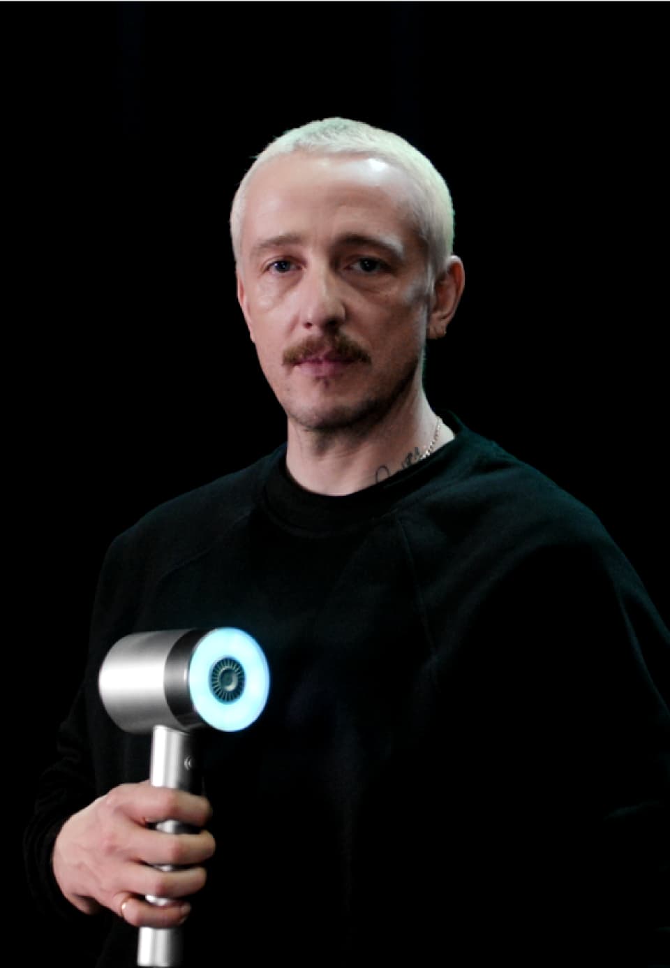 Portrait of Louis Byrne holding the AirLight Pro hairdryer