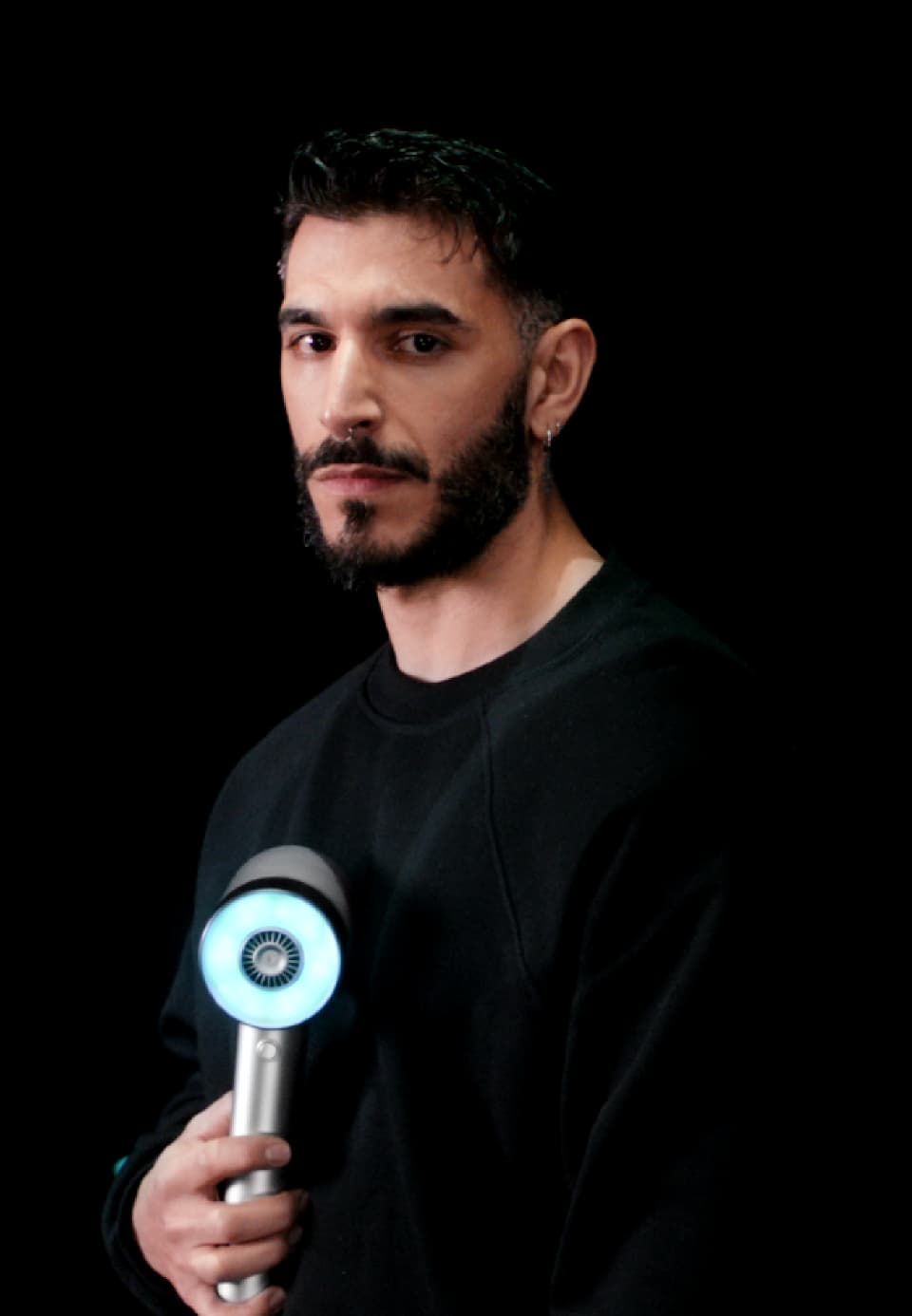 Portrait of Adrien Tavolieri holding the AirLight Pro hairdryer 